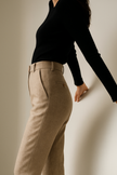 FJØRNA wool blend high waist tapered trousers for women, light-colored pants styled on a model.