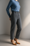 Women’s wool blend tapered high waist trousers by FJØRNA, shown in gray, featuring a tailored fit and classic style.