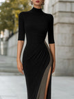 FJØRNA high-neck metallic thread knit slit maxi dress, elegant black dress with shimmering fabric and a stylish slit detail.