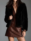 Brown eco leather zip-front mini dress for women by FJØRNA, showcasing the fitted silhouette and stylish design.