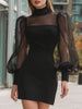 Black sheer puff sleeve mini dress by FJØRNA featuring structured design and black leather accents, suitable for stylish occasions.