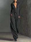 FJØRNA sparkling knit jumpsuit for women featuring a zip front, long sleeves, wide-leg pants, and a stylish, textured design.