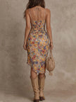 FJØRNA ruched midi floral dress featuring a casual style with a fitted bodice and flowing skirt, adorned with vibrant floral patterns.