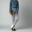 FJØRNA women's wool blend trousers featuring a tailored fit and classic style, shown in a neutral color.