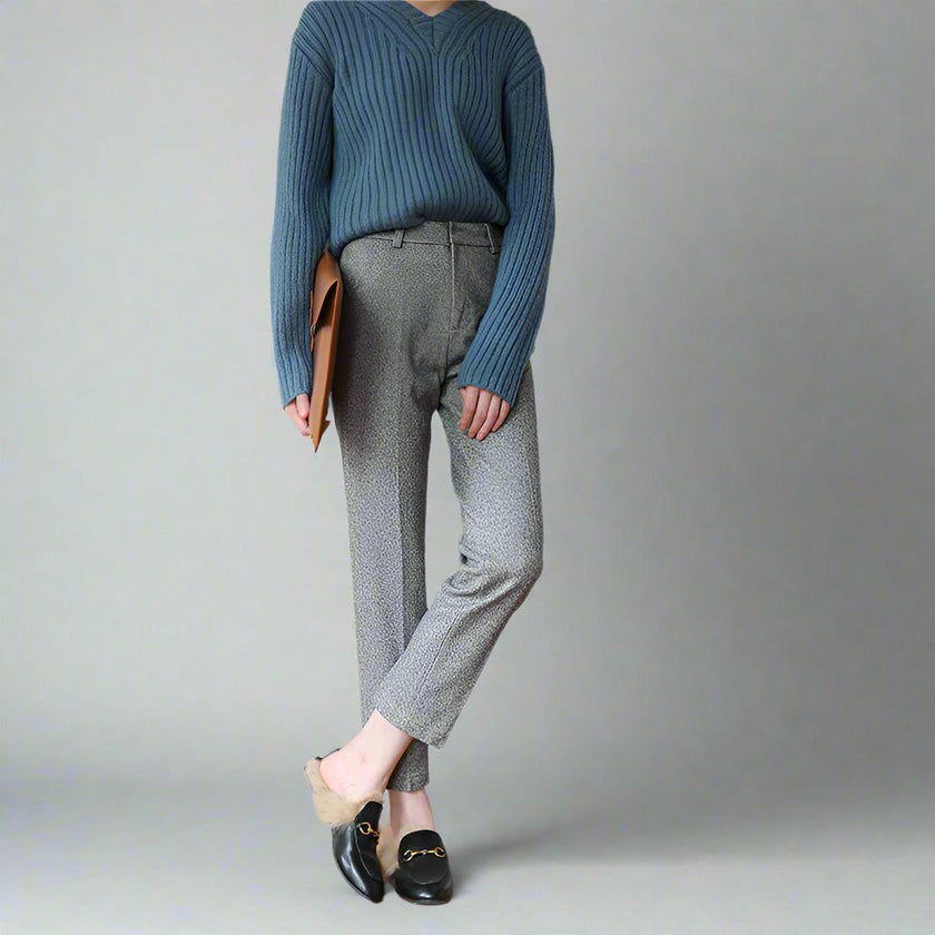 FJØRNA women's wool blend trousers featuring a tailored fit and classic style, shown in a neutral color.