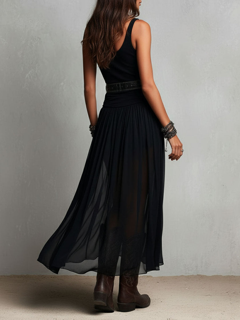 FJØRNA black maxi dress, casual style, flowy fabric, sleeveless design, full-length dress suitable for everyday wear