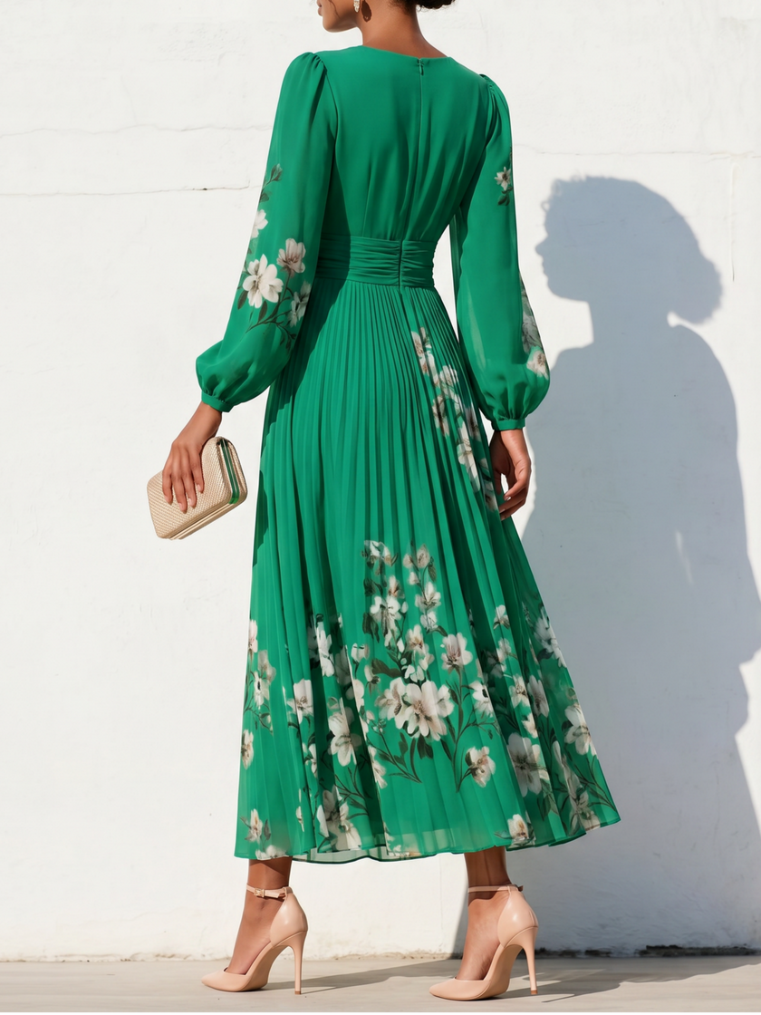 FJØRNA floral print long-sleeved V-neck pleated dress with elegant floral pattern and flowing silhouette.