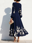 FJØRNA floral print long-sleeved V-neck pleated dress with elegant design and feminine style, showcasing a flowy silhouette.