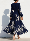 FJØRNA floral print long-sleeved V-neck pleated dress with elegant design and nature-inspired pattern, perfect for stylish occasions.