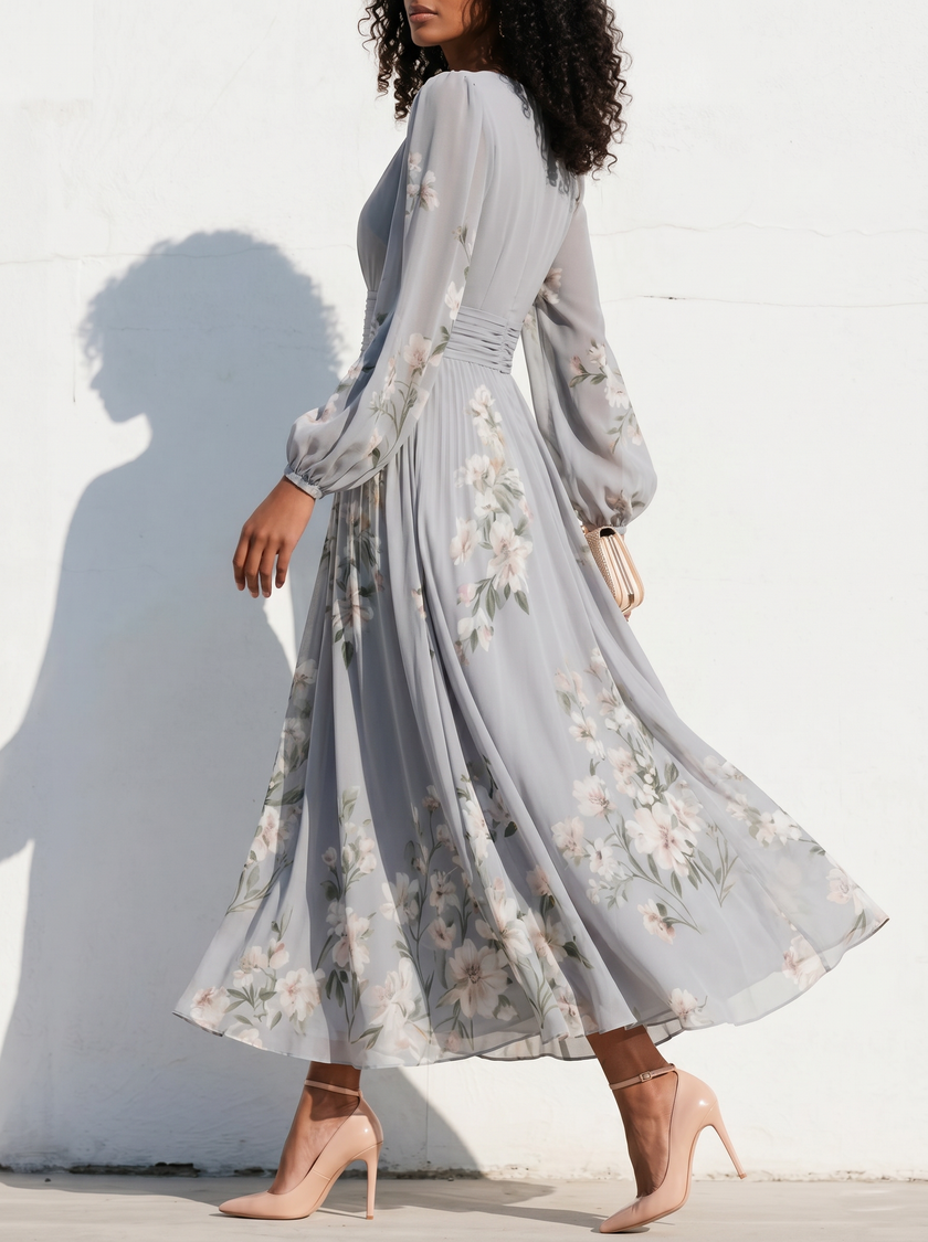 FJØRNA floral print long-sleeved V-neck pleated dress with elegant design and vibrant floral pattern, perfect for stylish occasions.