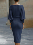 White FJØRNA dress with bat sleeves, waist-cinching design, elegant and fashionable for stylish occasions.