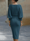 White FJØRNA dress with bat sleeves, waist-cinching design, elegant and fashionable, perfect for stylish occasions.