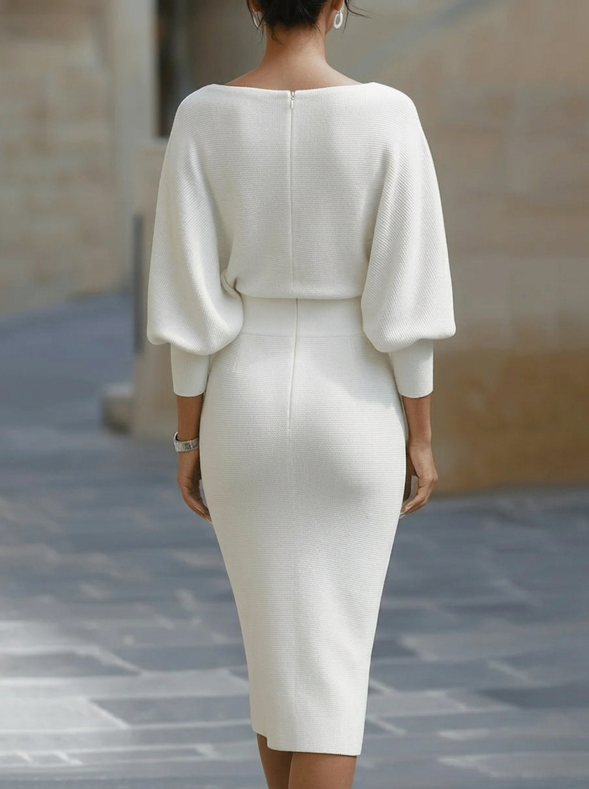White FJØRNA dress with bat sleeves, waist-cinching design, elegant and fashionable, perfect for a sophisticated look.