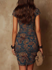 FJØRNA bodycon mini dress for women, close-up of figure-hugging design in sleek fabric, perfect for stylish occasions.