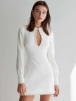 White FJØRNA long-sleeve mini dress with pearl-embellished keyhole neckline and fitted silhouette.