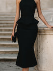 FJØRNA halter peplum midi dress for women, stylish sleeveless dress with fitted bodice and flared hem, perfect for summer events.