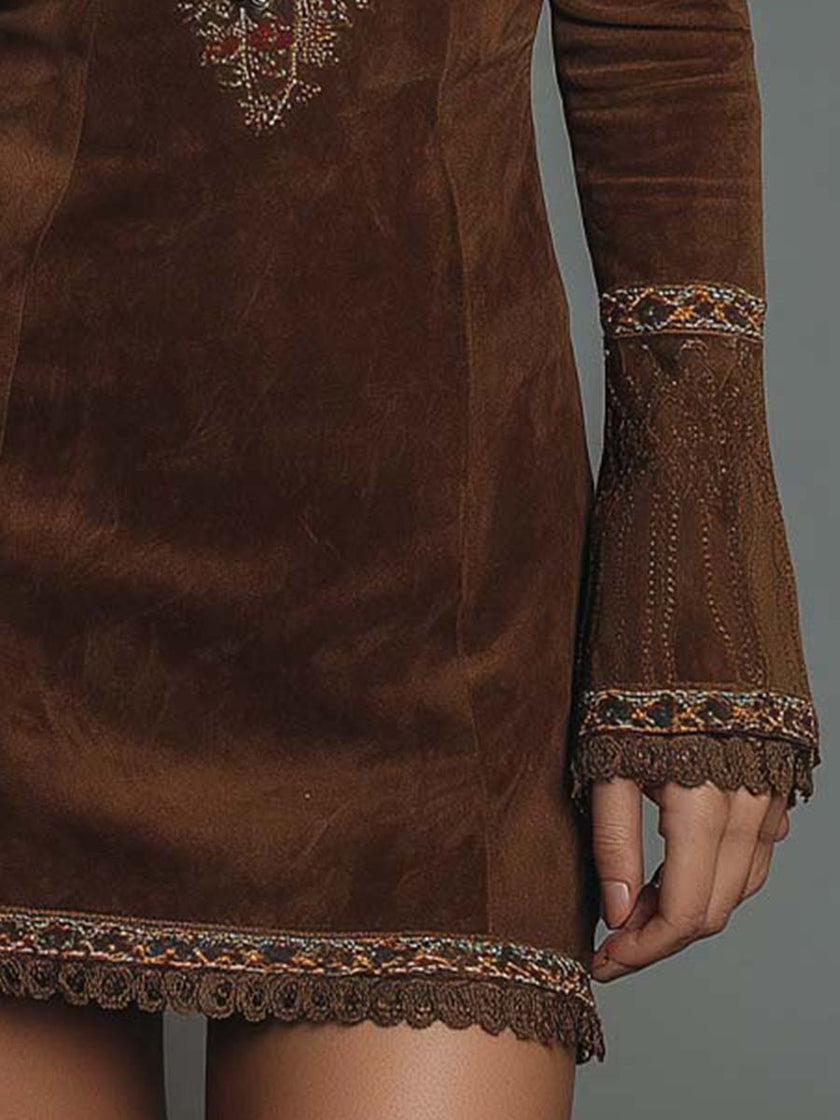 Vintage brown suede mini dress with embroidered detailing from FJØRNA, showcasing a stylish, textured design and classic fit.