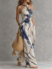 White ink wash print sleeveless jumpsuit with halter neck and wide-leg design featuring pockets, by FJØRNA.