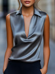 Gray satin plunge neck top for women by FJØRNA, featuring a sleek design and stylish fit.