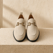 FJØRNA men's suede slip-on loafers featuring a sleek design and comfortable fit, shown in a close-up view.