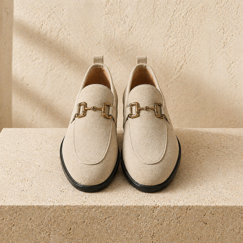 FJØRNA men's suede slip-on loafers featuring a sleek design and comfortable fit, shown in a close-up view.