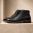 FJØRNA men's leather boots featuring sleek design, sturdy soles, and classic style perfect for casual or formal wear.