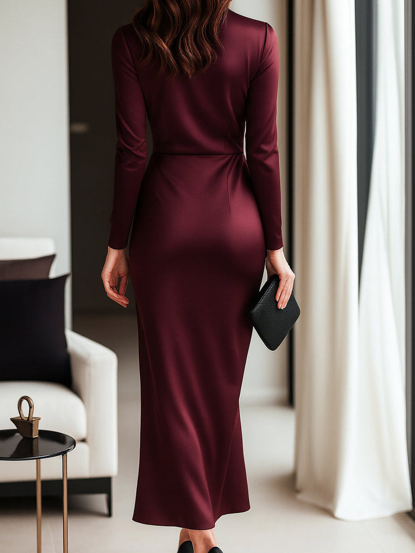FJØRNA timeless burgundy satin wrap dress with waist tie detail, showcasing smooth fabric and elegant design.