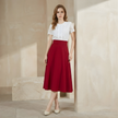 FJØRNA women's high waist midi skirt with pockets, stylish and comfortable for casual and semi-formal wear.