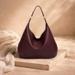 Large women's leather bag by FJØRNA, showing the spacious design and high-quality brown leather material.
