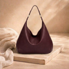 Large women's leather bag by FJØRNA, showing the spacious design and high-quality brown leather material.
