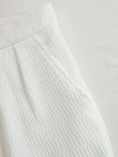 Cream textured lantern sleeve two-piece pants set by FJØRNA, featuring a stylish top and matching pants in a cozy fabric.