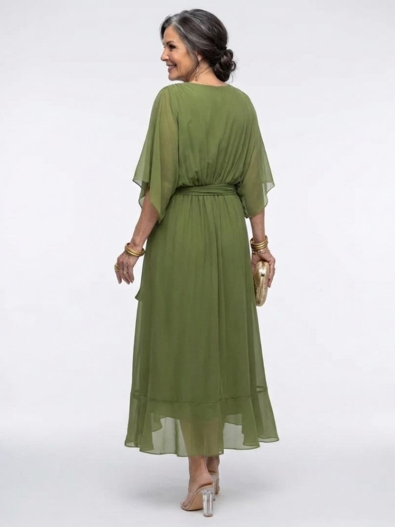 Flowy summer midi dress for women by FJØRNA, featuring a wrap design and lightweight, breezy fabric perfect for warm weather.