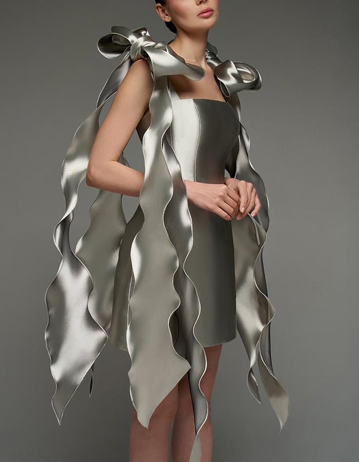 Silver satin cocktail dress for women, square neck, bodycon fit with cape style and strappy details by FJØRNA.
