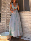 FJØRNA women's tie-dye print maxi dress with hollow slit, perfect for summer, featuring vibrant colors and flowing fabric.