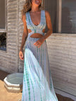 FJØRNA women's tie-dye print maxi dress with hollow slit design, perfect for summer, featuring vibrant colors and flowing fabric.