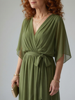 FJØRNA women's summer midi dress, flowy and lightweight, shown in a natural pose, perfect for warm weather occasions.