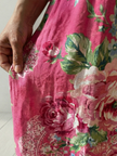 FJØRNA women's summer midi dress with floral pattern, long sleeves, and flowing fabric perfect for warm weather.