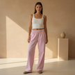 FJØRNA women's lounge trousers with elastic waist and side pockets, comfortable casual pants for relaxed wear.