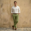 FJØRNA men's linen blend straight leg trousers with pleats, shown in a neutral color, tailored fit, and classic style.