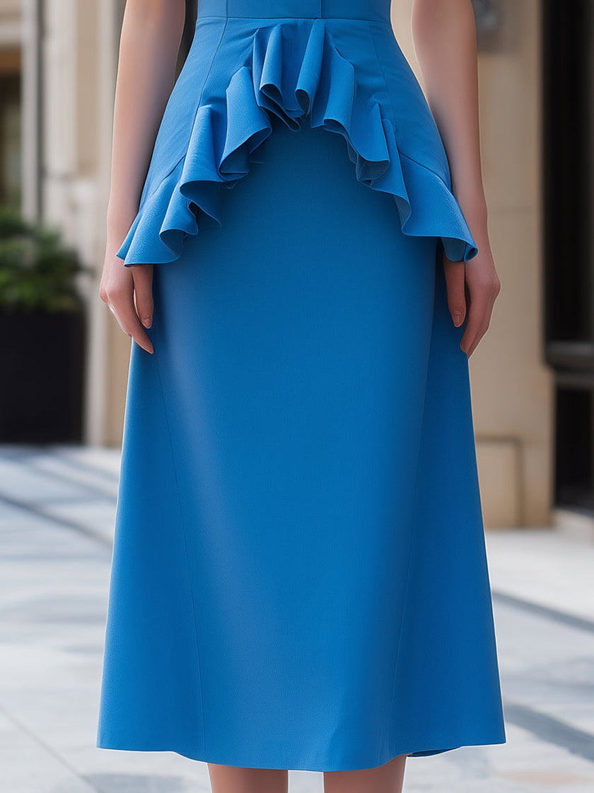 Elegant blue sleeveless midi dress with ruffle waist by FJØRNA, featuring a flowy design perfect for summer occasions.