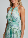 FJØRNA women's floral summer midi dress with halter neck, sleeveless design, and pleated skirt, perfect for warm weather.