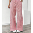 FJØRNA women's lightweight summer trousers with drawstring waist and pockets, made from breathable fabric for comfortable wear.