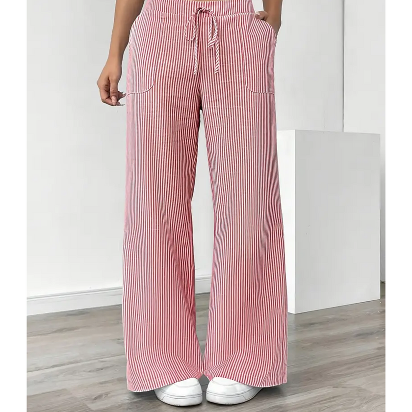 FJØRNA women's lightweight summer trousers with drawstring waist and pockets, made from breathable fabric for comfortable wear.