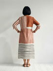 FJØRNA summer midi dress for women with striped pattern, long sleeves, and a flowy, relaxed fit for warm weather.
