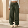 FJØRNA men's corduroy wide leg trousers with relaxed fit, featuring a high waist and classic corduroy texture in a neutral color.