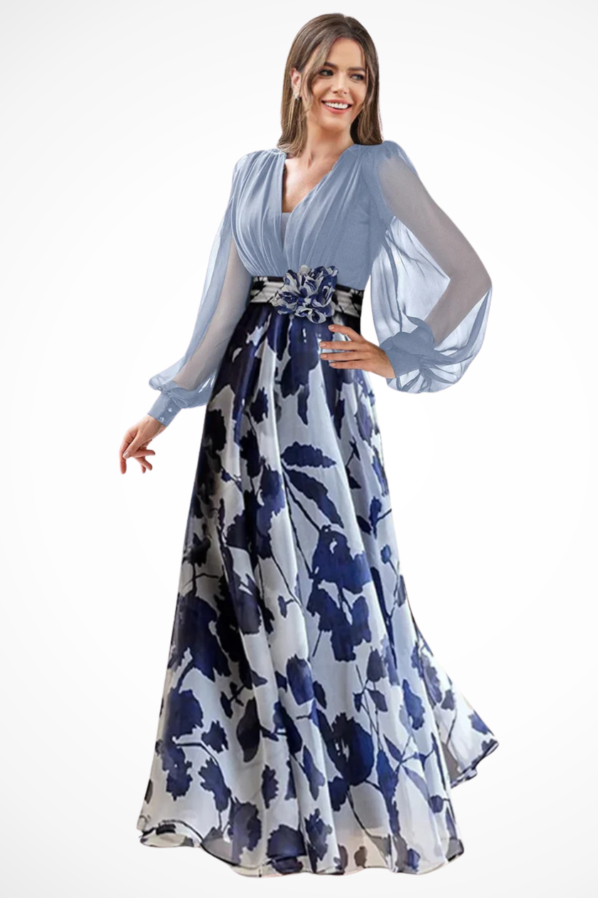 FJØRNA floral print maxi wedding guest dress with V-neck, balloon sleeves, and flowing skirt, perfect for special occasions.