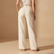 FJØRNA women's relaxed fit straight leg trousers, lightweight pants with a comfortable fit, shown in a neutral color.