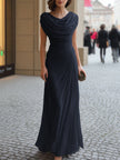 FJØRNA draped cowl-neck ruched maxi dress in soft fabric, featuring a flowing silhouette and elegant design.