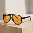 Unisex retro aviator sunglasses from FJØRNA with metal frames and dark lenses, stylish accessories for men and women.