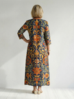 FJØRNA women's floral summer midi dress with long sleeves, wrap style, tailored fit, perfect for warm weather.